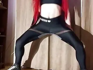 Redhead ts shows her fake tits and does yoga chores